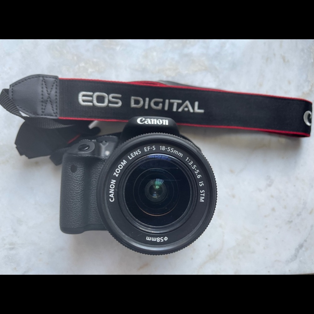 Brand new Canon Rebel T5i with 58mm lens comes with box and strap.